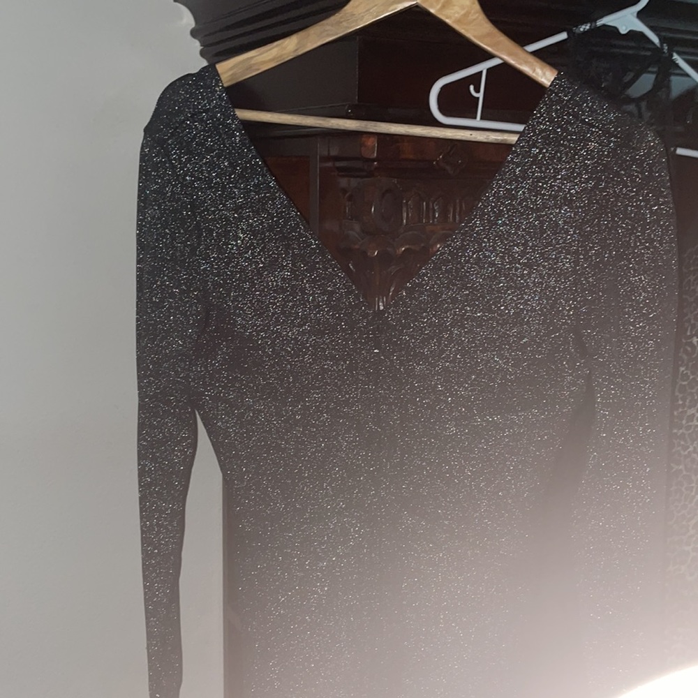 Bebe Black and silver Lurex Bebe dress size L but fits medium.  Zipper in front